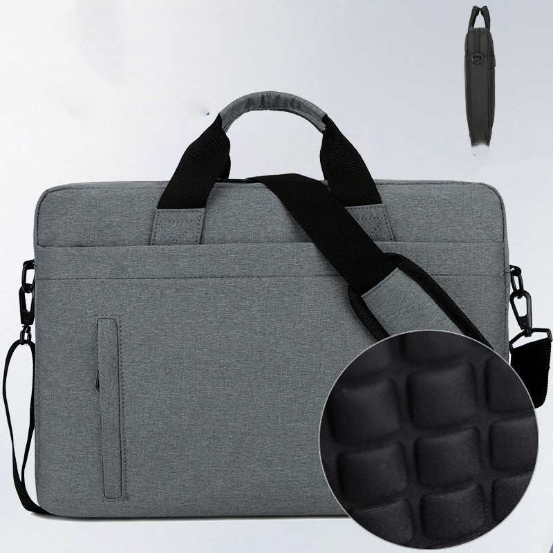 Waterproof shoulder bag for laptops, gray nylon computer bag with padded shoulder strap and anti-theft design.