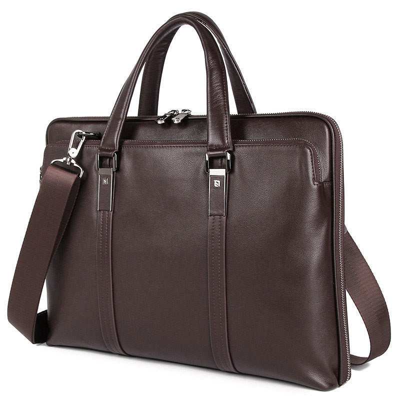 Leather business briefcase in dark brown with dual handles and adjustable shoulder strap.