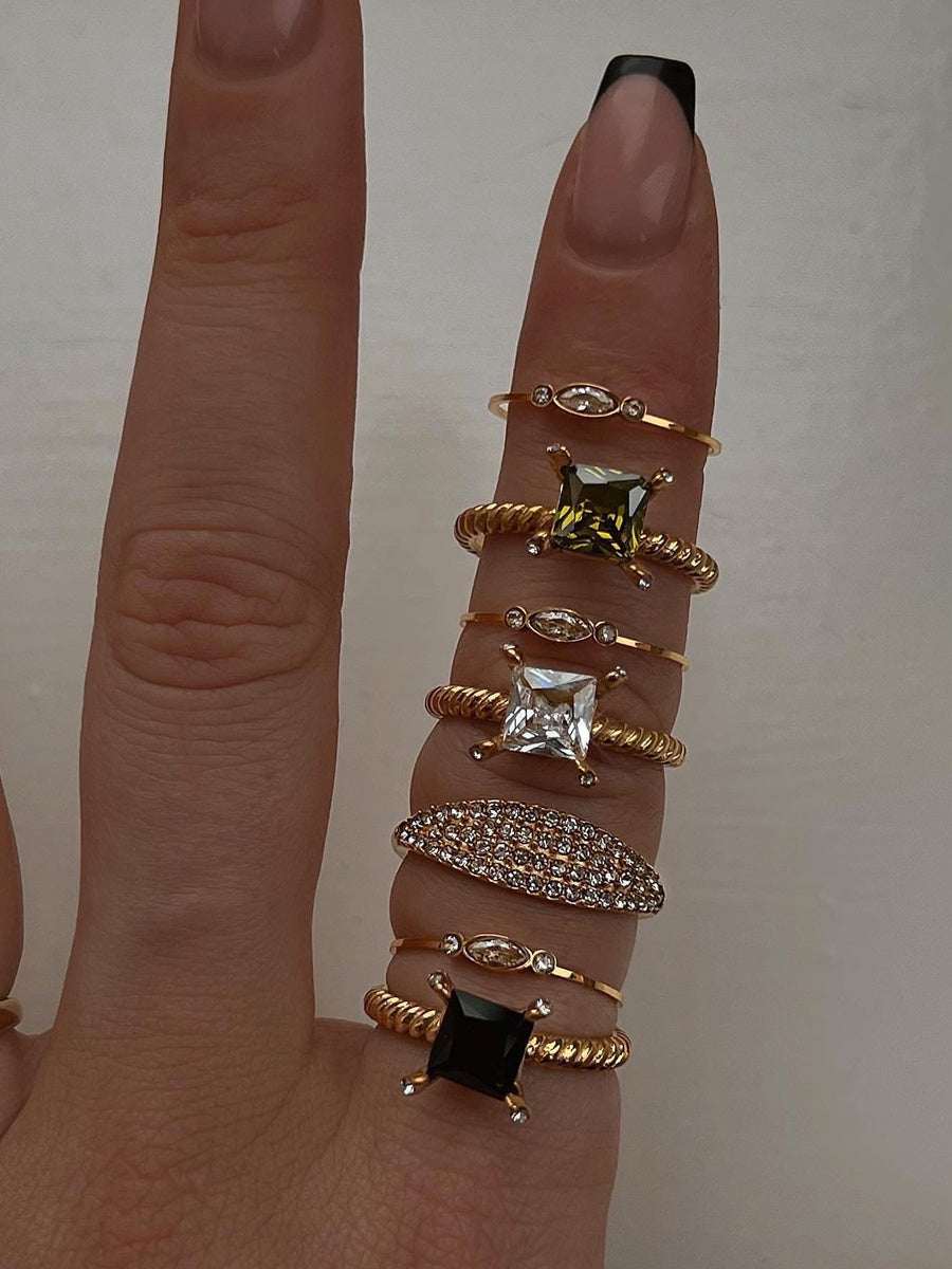 Candy-colored pearl statement ring on finger with gold and silver plated alloy bands