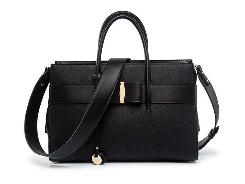 Fashionable computer bag for women in stylish black faux leather with adjustable strap, perfect for daily use.