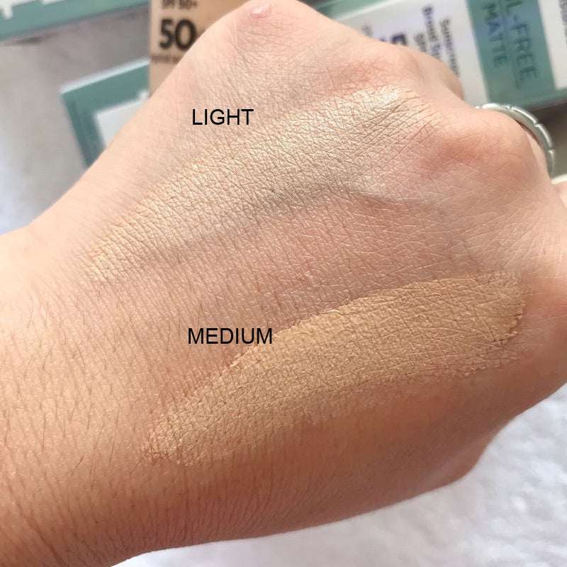 Matte oil-free liquid foundation swatches on hand showing light and medium shades for oil control and sun protection