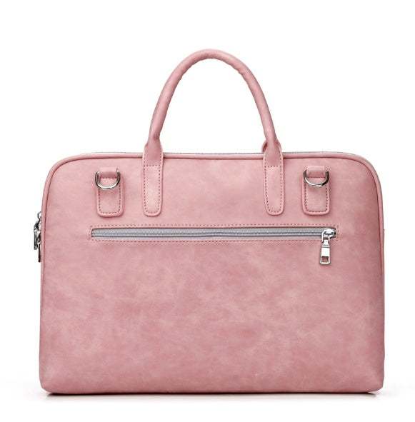 Faux leather laptop bag for women in pink color with zipper and handles.
