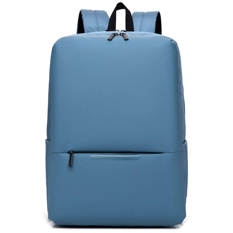 Light blue large-capacity business laptop backpack with zipper and soft handles.