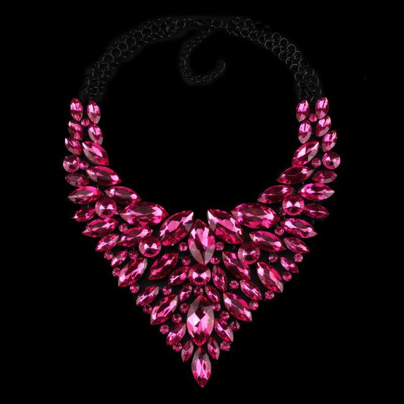 Fashion diamond-studded alloy necklace with pink water drop-shaped crystals on black background