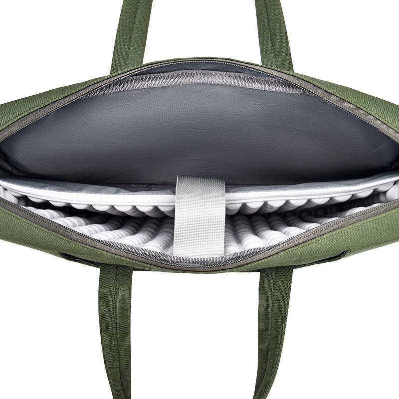 Interior view of large capacity laptop bag for men showing padded compartment for laptop protection.