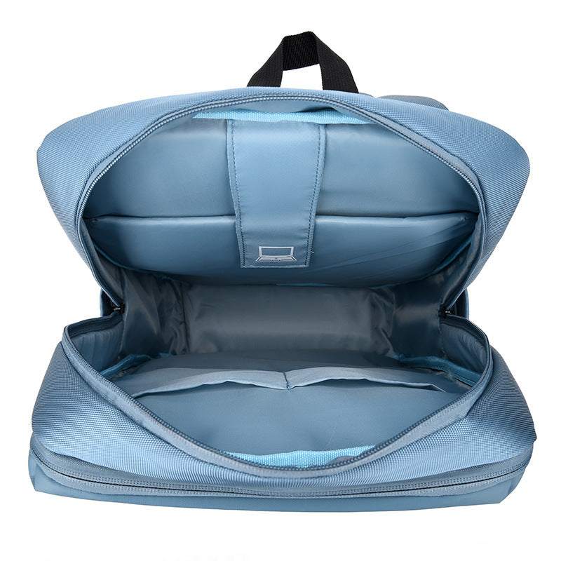 Interior view of a large-capacity business laptop backpack showing spacious compartments and soft lining.