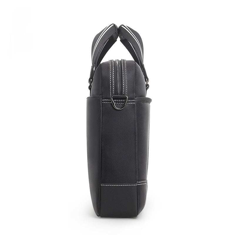 Side view of a black large capacity men's laptop bag with soft handles.