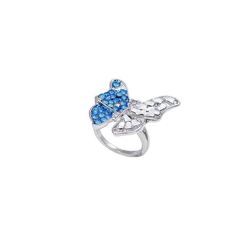 Silver butterfly crystal ring with blue accents, glamorous ethnic-inspired design for women
