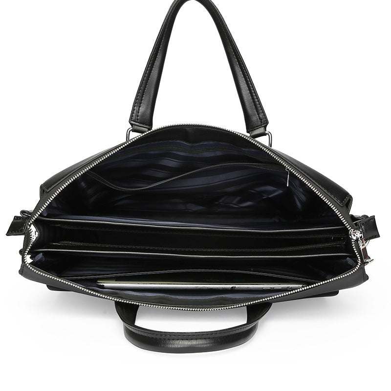 Interior view of an anti-theft crossbody handbag showing multiple compartments and black lining.