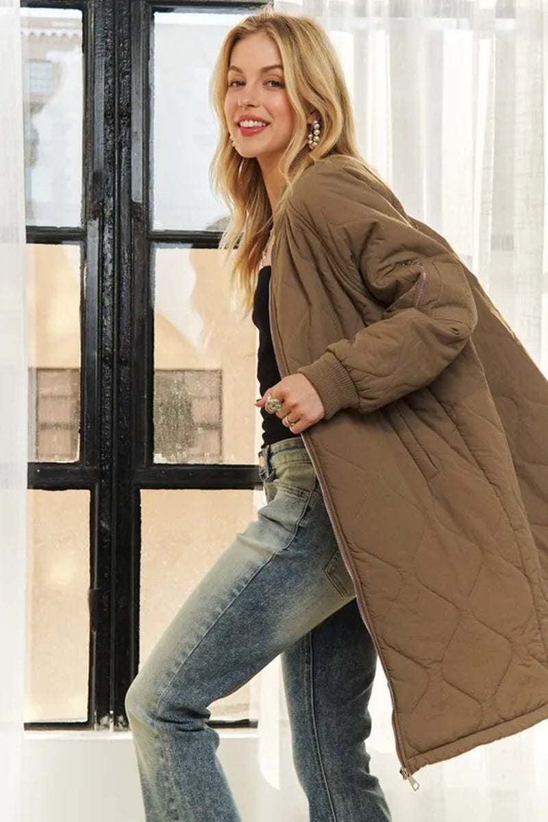 Woman wearing ADORA zip up long utility jacket with quilted design and pockets