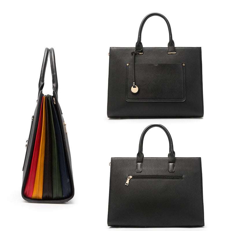 Fashionable computer bag for women showcasing a sleek black design with colorful accents and multiple compartments.