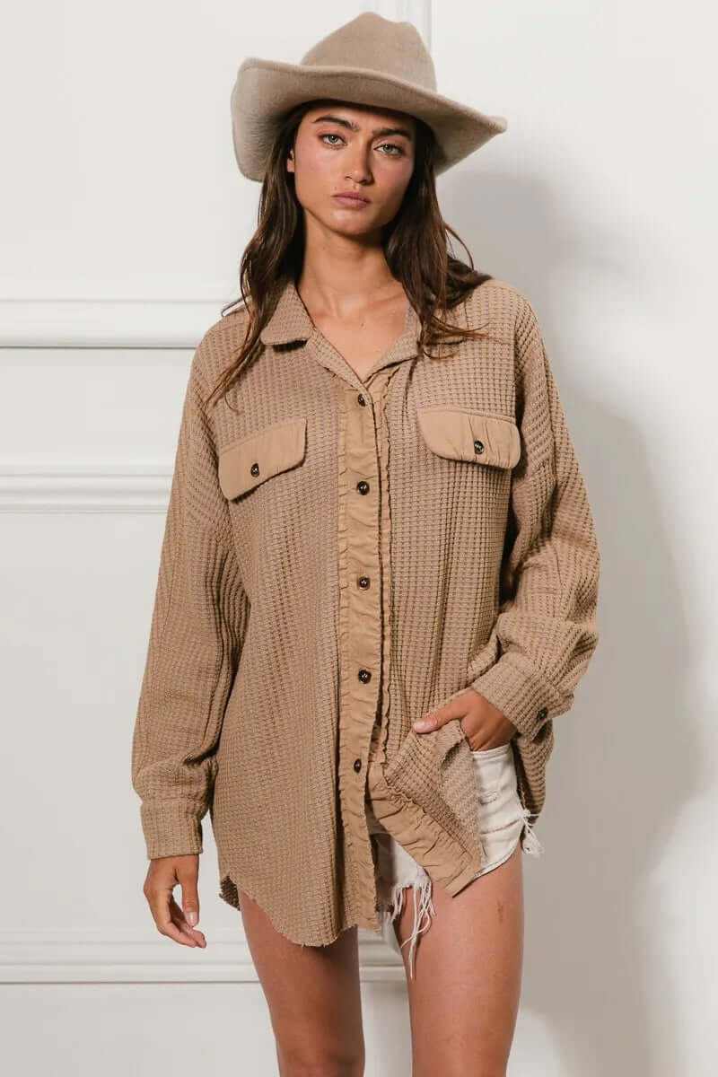 Bibi Heavy Waffle Oversized Shacket in beige, featuring buttoned front and two chest pockets, styled casually with a hat.