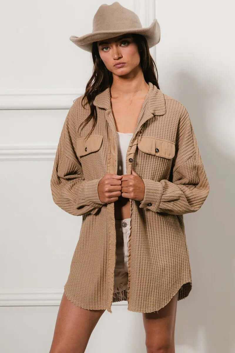 Bibi Heavy Waffle Oversized Shacket in beige, perfect for layering, styled with shorts and a hat.