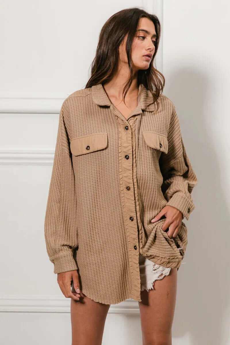 Model wearing a Bibi heavy waffle oversized shacket in beige, featuring buttoned pockets and a relaxed fit.