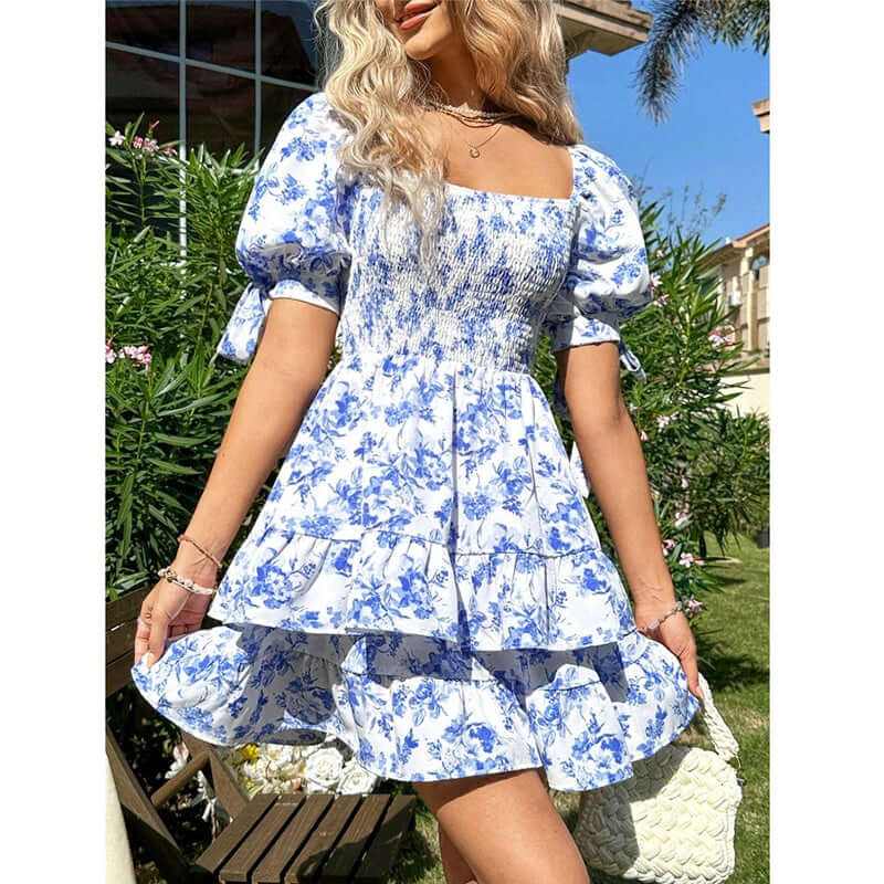 Women’s puff sleeve mini dress in blue floral print, off-shoulder design, with smocked bodice and ruffle hem, perfect for summer.