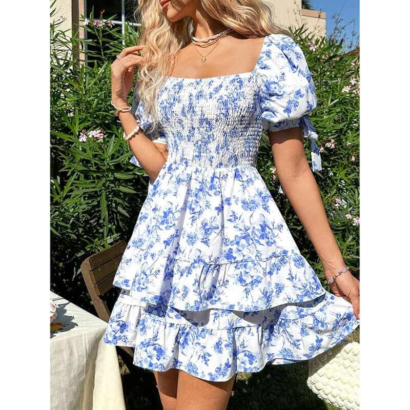 Women's puff sleeve off-shoulder boho floral mini dress with smocked bodice and ruffle hem.