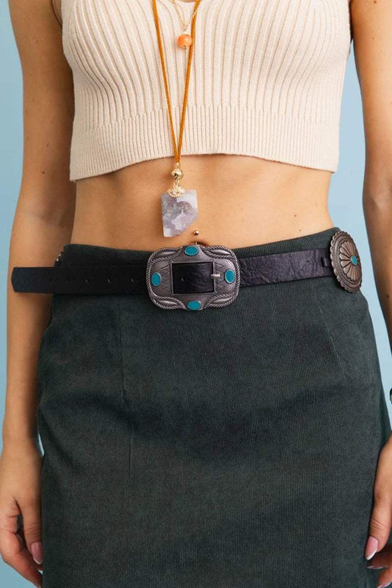 Boho Turquoise Western Concho Belt worn with a ribbed top and suede skirt, showcasing intricate silver conchos and turquoise accents.