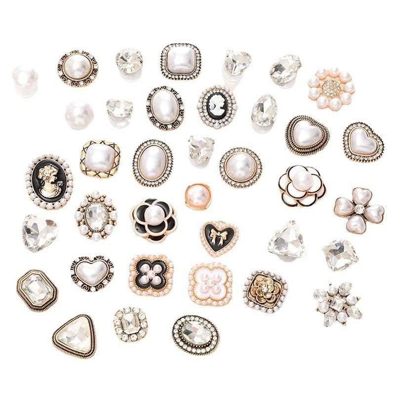Assorted pearl and crystal shoe ornaments in various shapes for stylish shoe embellishments.