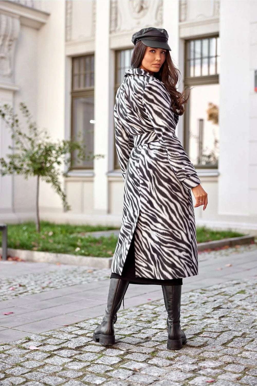 Chic Roco Inspired Longline Coat in zebra print with a stylish collar, worn by a model outdoors.