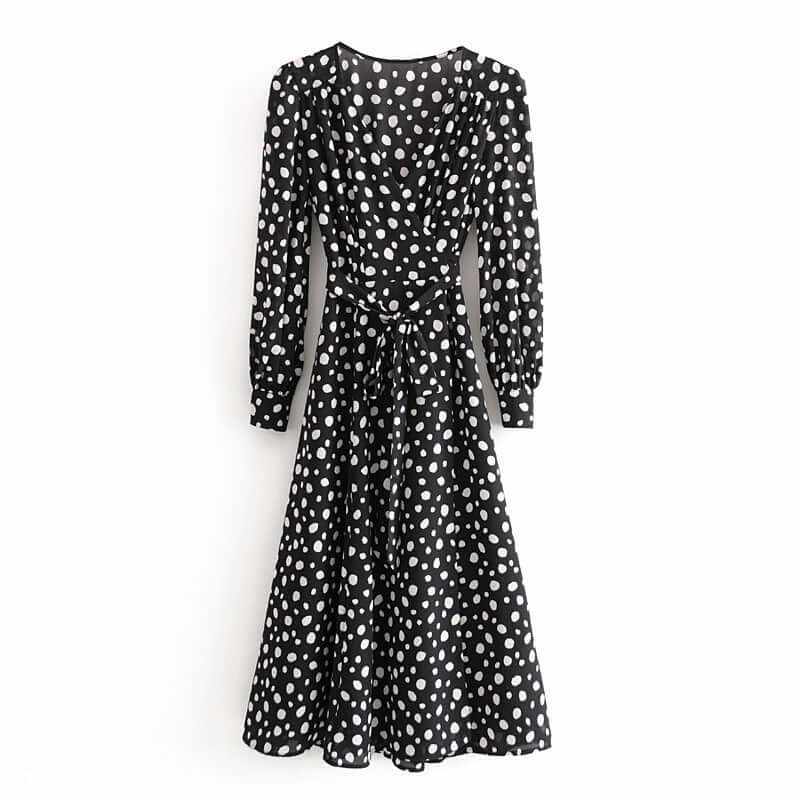 Black split wrap long sleeve chiffon dress with white polka dots, elegant style for versatile occasions.