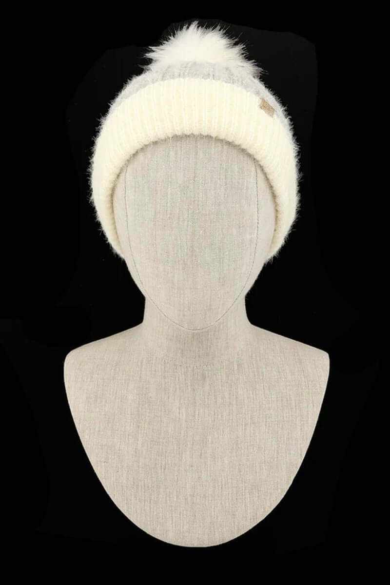 Chunky knit faux fur pom beanie in cream, showcasing super soft yarn and fluffy pom for winter style and warmth.