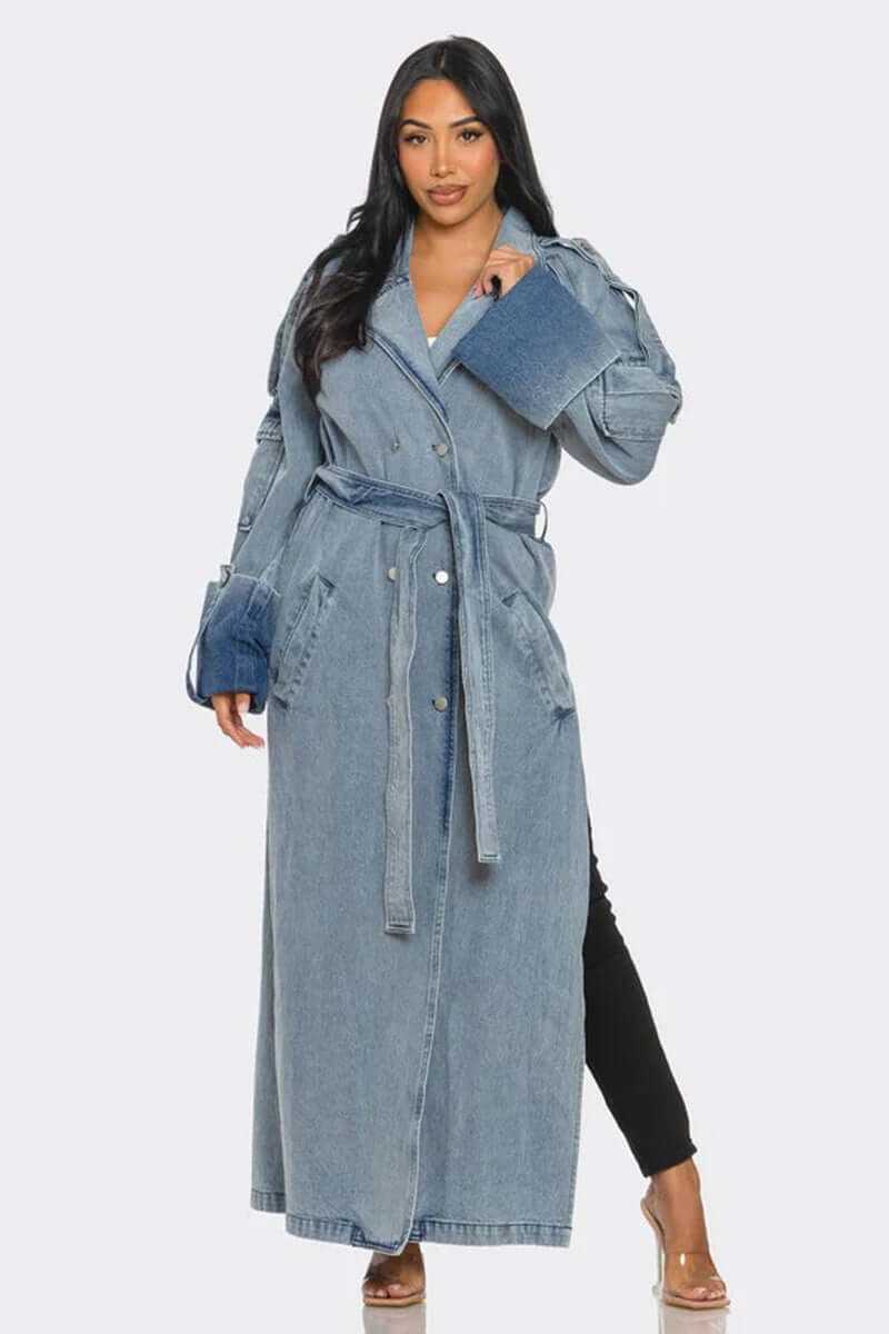 woman wearing classic longline denim trench coat with belted waist and oversized cuffs