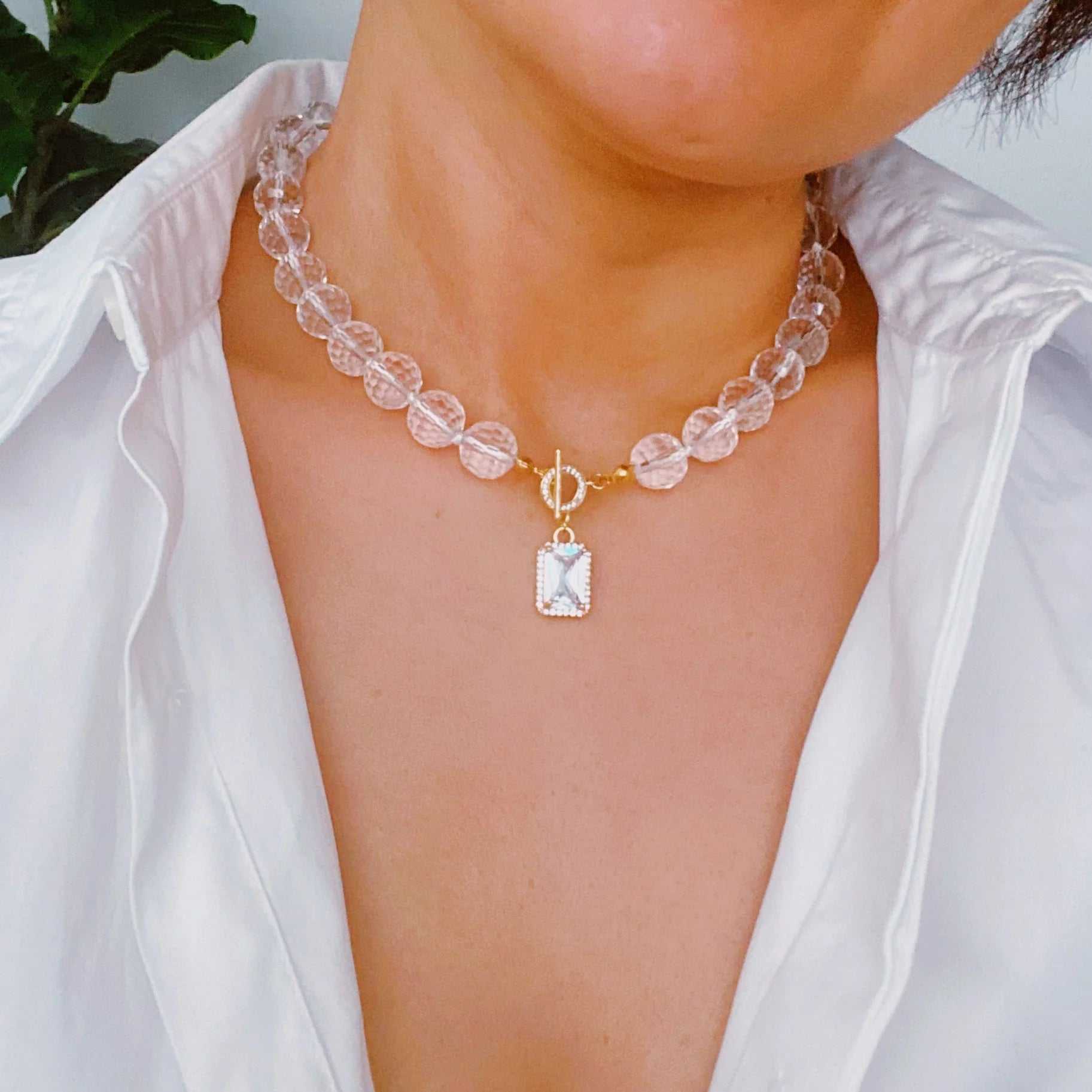 Elegant clear crystal ball chain necklace with faceted glass beads and jeweled pendant, perfect for any occasion.