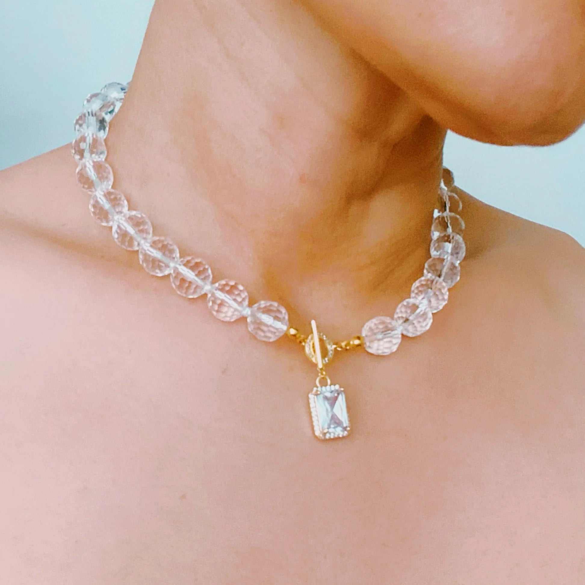 Clear crystal ball chain necklace with faceted glass beads and a cubic zirconia pendant, perfect for any occasion.