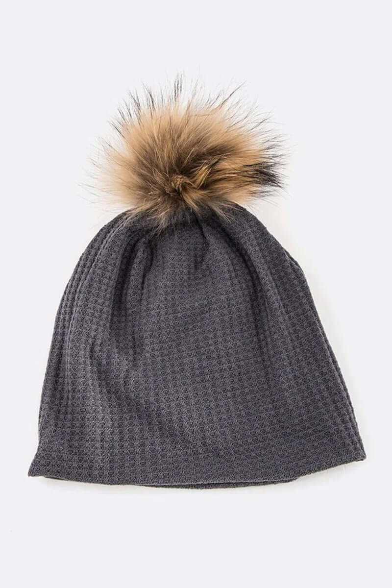 Cotton slouchy beanie with faux pom, perfect for cold weather style and comfort.