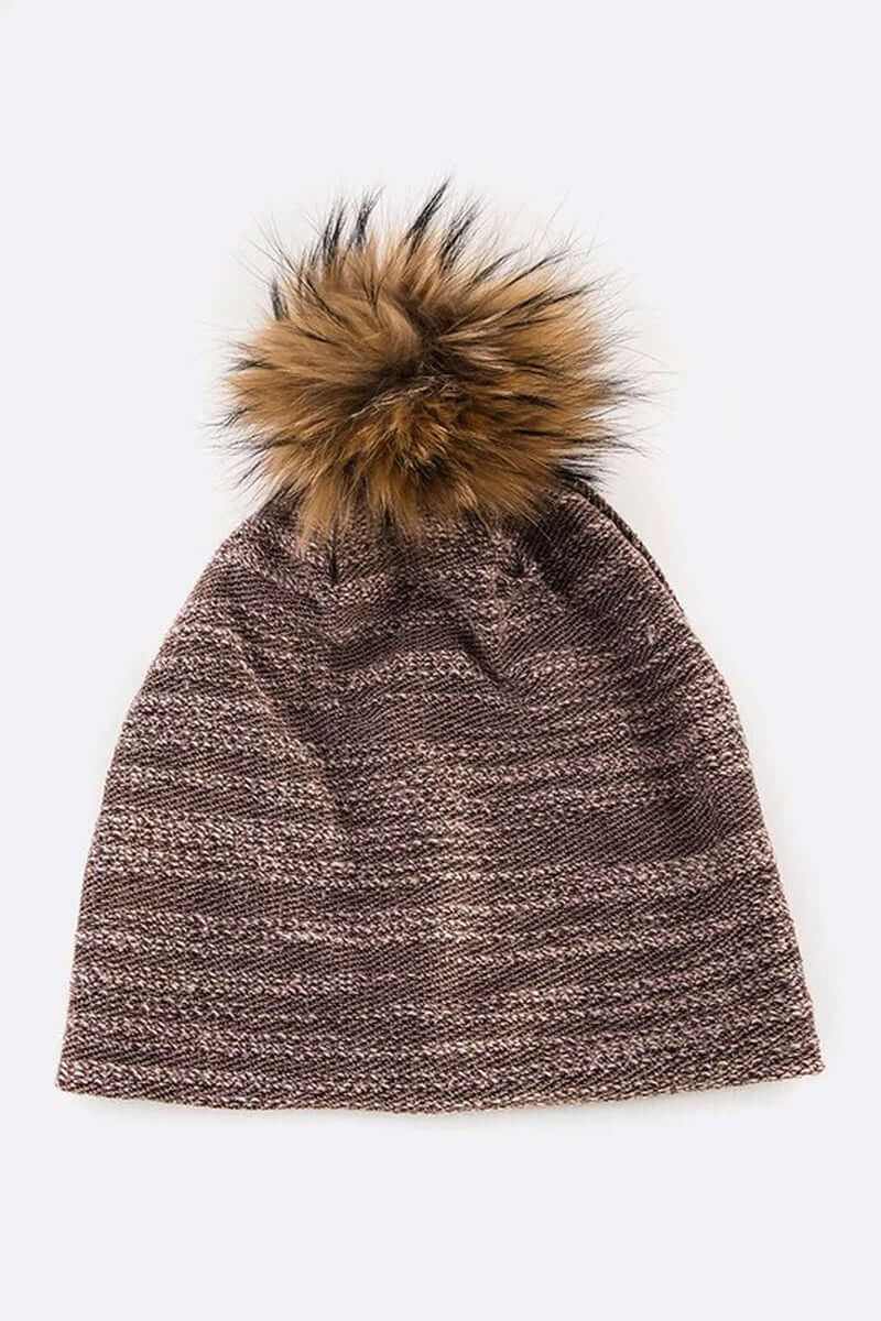 Cozy faux cotton blend slouchy beanie with playful faux fur pom, perfect for winter style and warmth.