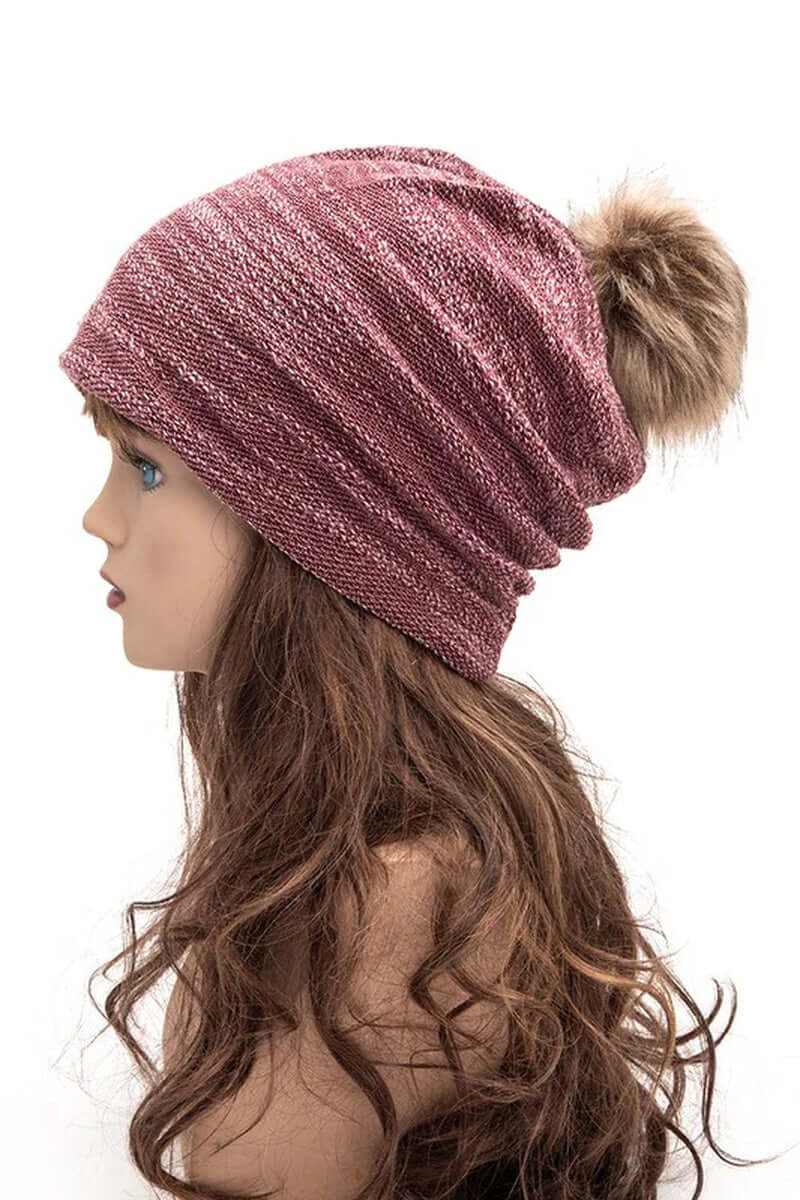 Side view of a cozy faux cotton blend slouchy pom beanie in burgundy, featuring a fluffy pom on top.