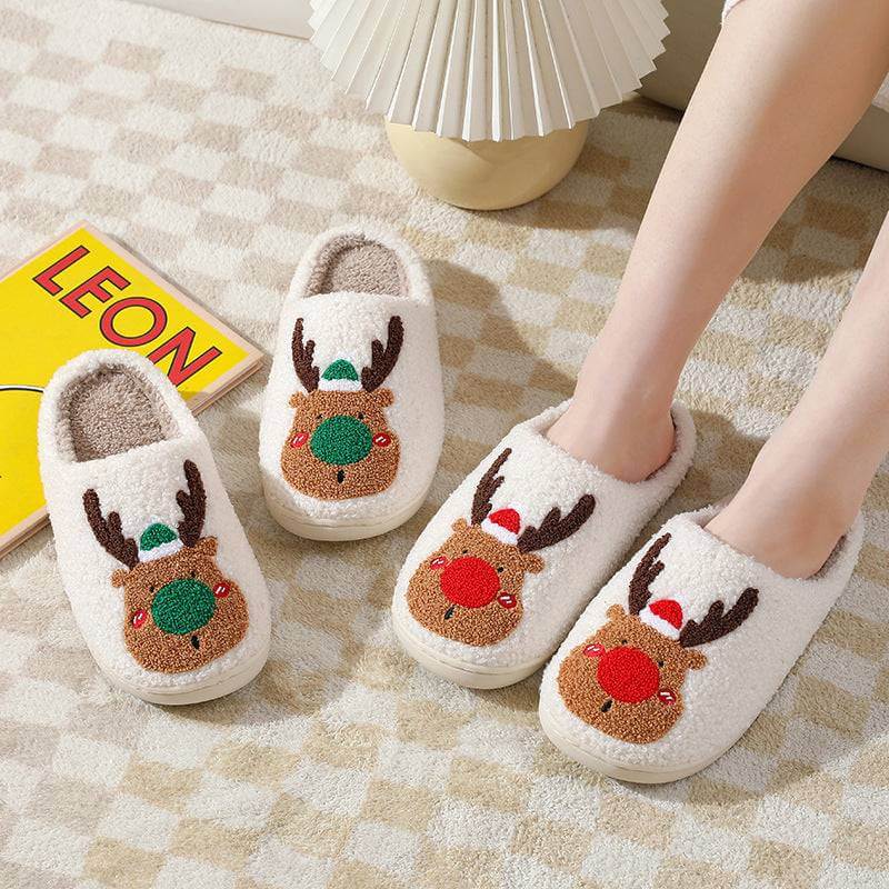 Cozy winter home slippers with cute reindeer design, plush material, and warm artificial wool lining for comfort.