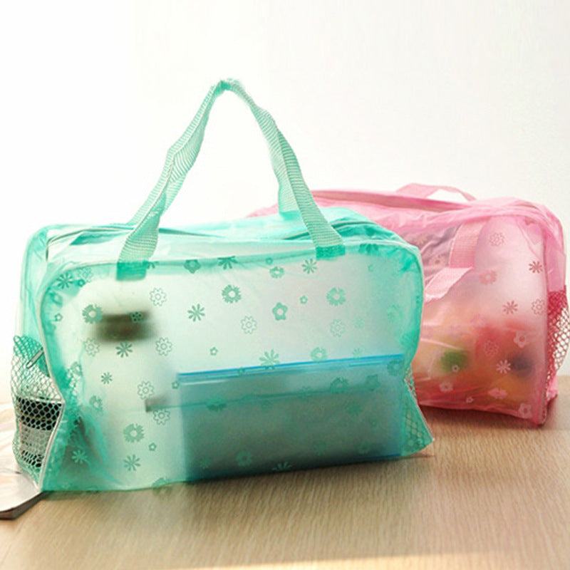 Transparent floral travel waterproof cosmetics bags in green and pink with handles and side mesh pockets