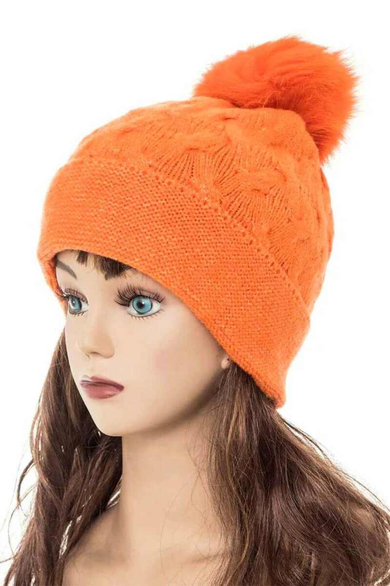 Bright orange cuffed slouchy beanie with fur pom, showcasing a stylish and cozy design for winter wear.