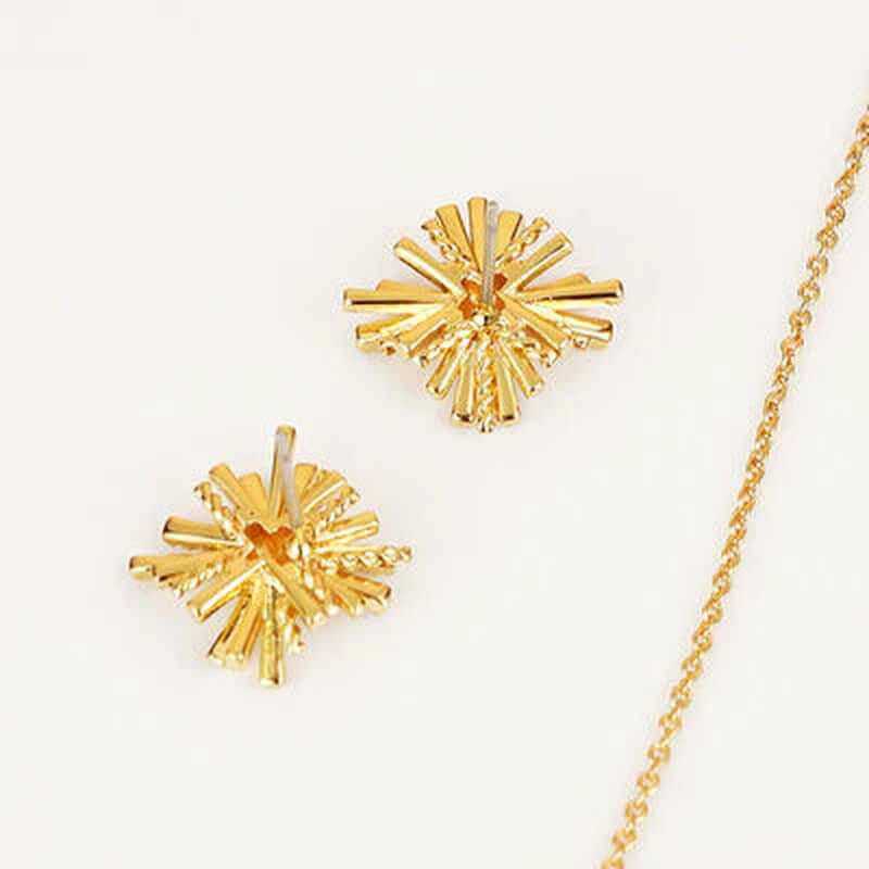 Dainty starburst gold-plated earrings with a unique design, part of a jewelry set, featuring a shiny alloy and zircon accents.