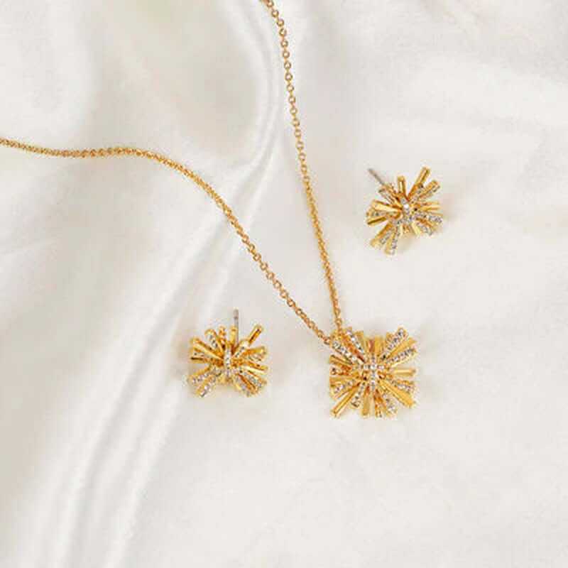 Dainty starburst gold plated jewelry set featuring a necklace and matching earrings, embellished with zircon stones.