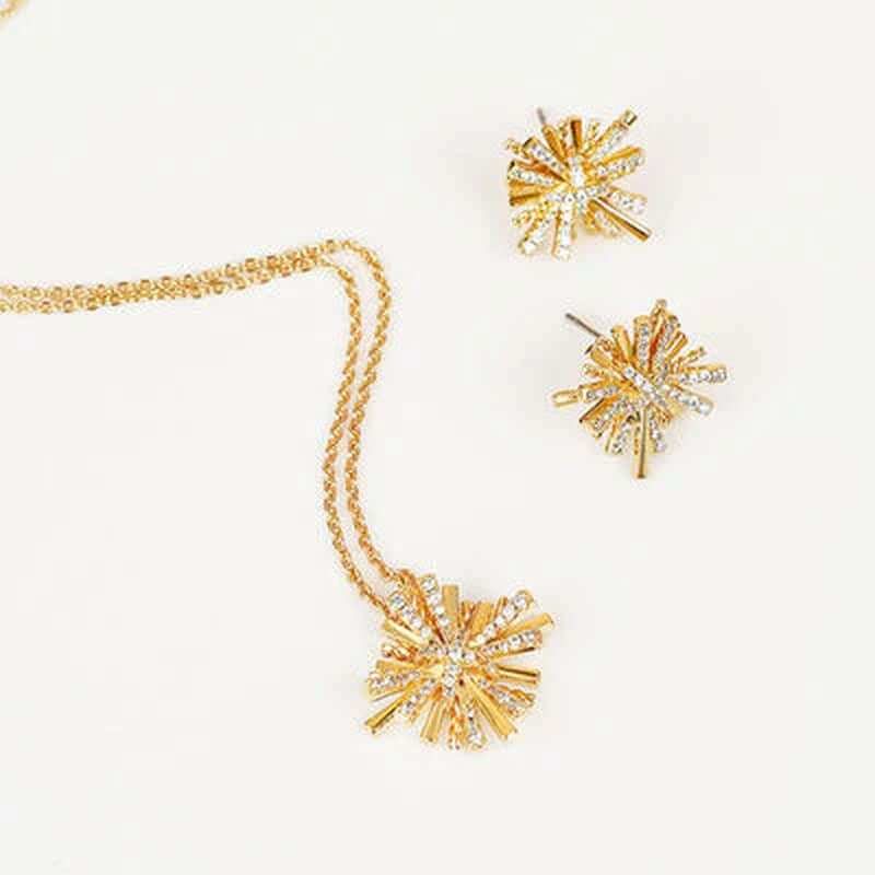 Dainty starburst gold plated jewelry set featuring a pendant necklace and earrings with zircon accents.