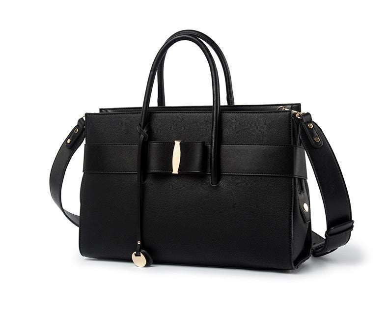 fashionable computer bag for women in black faux leather with stylish handles and detachable strap