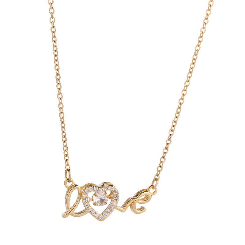 Fashion clavicle chain necklace with gold-tone "love" pendant and heart detail