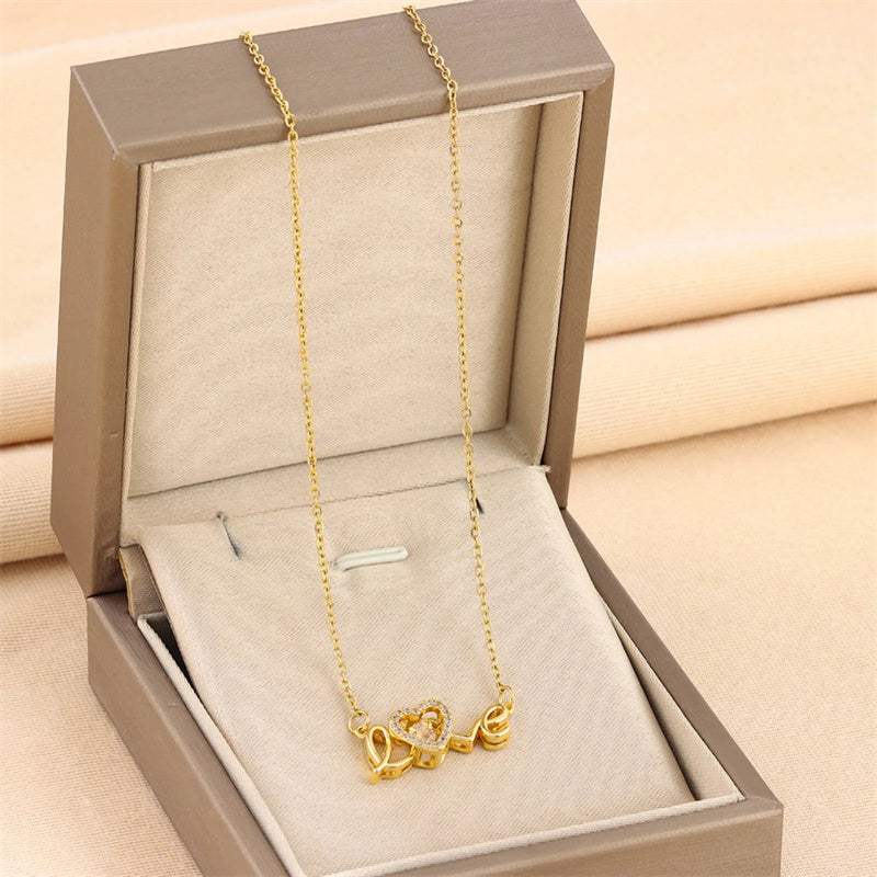 Gold fashion clavicle chain necklace with love pendant in a jewelry box
