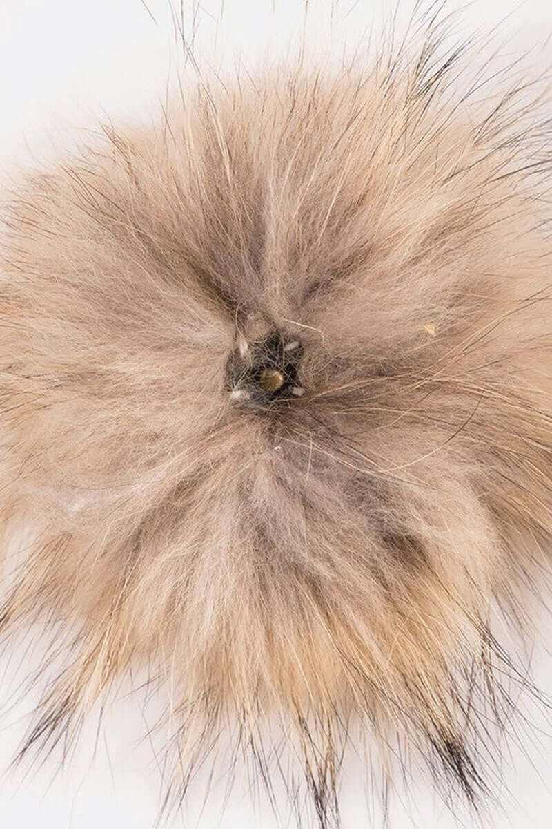 Fluffy faux fur pom in soft beige and brown tones, perfect for adding playful flair to winter beanies.