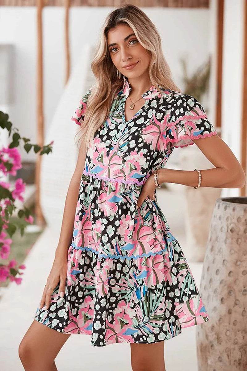 Floral ricrac embellished tiered mini dress in vibrant colors, perfect for warm weather layering or a playful summer look.