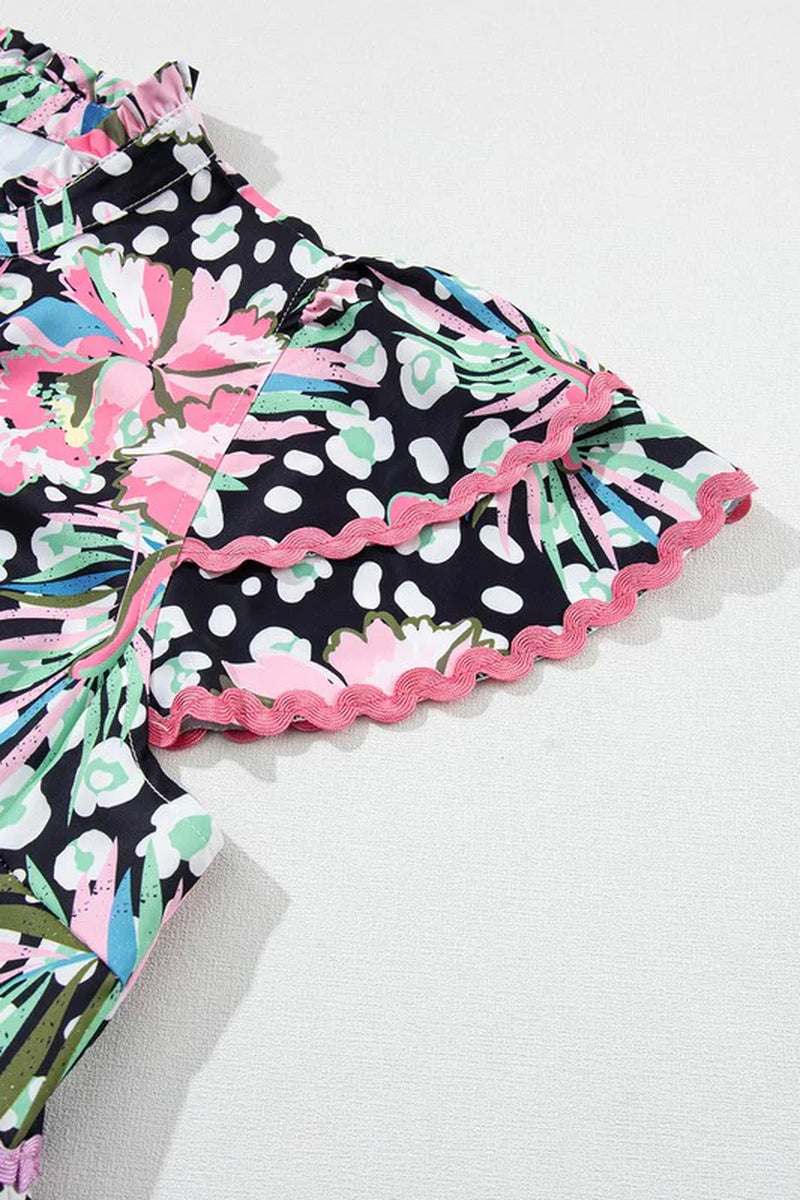 Floral ricrac embellished tiered mini dress with bold pink and black floral print and playful ruffled hem.