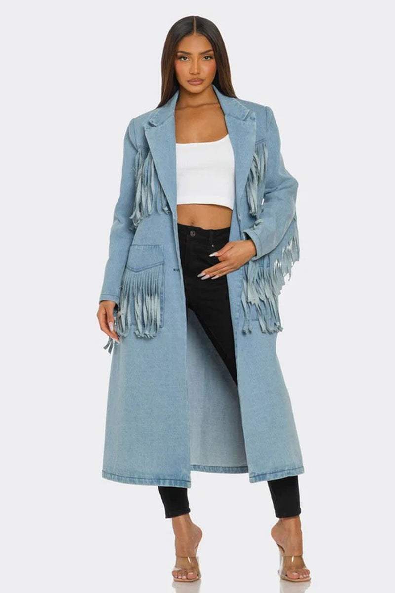 Fringed longline denim trench coat styled with a white crop top and black pants, perfect for edgy fashion looks.