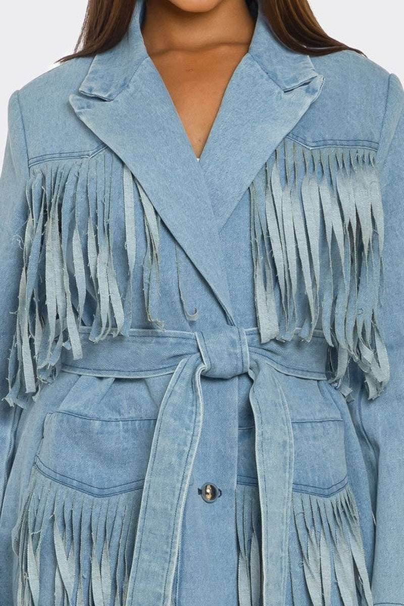 Fringed longline denim trench coat with waist-cinching belt, perfect for bold fashion statements.