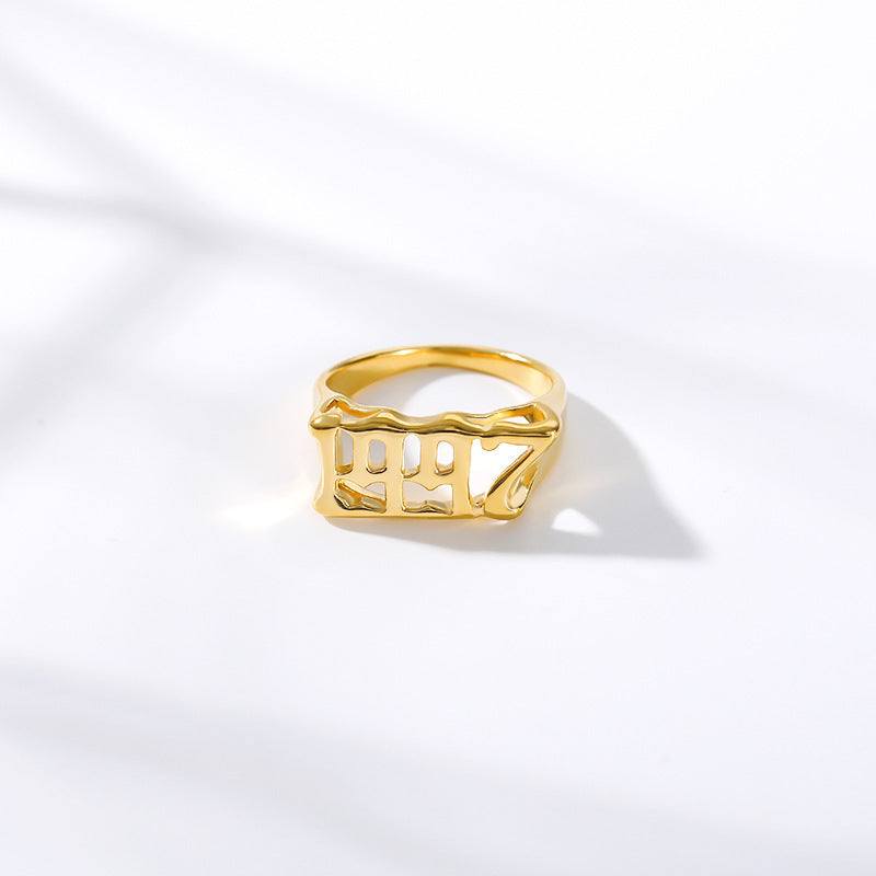 Golden futuristic and vintage cyberpunk style ring with characters design on white background