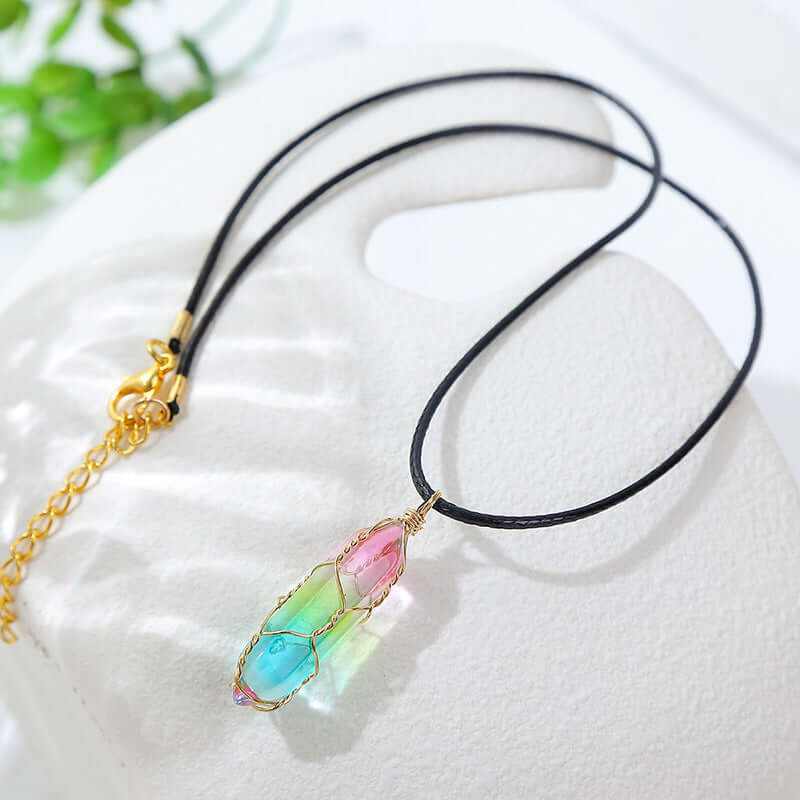 Women's geometric crystal necklace with colorful pendant on black cord, perfect for modern fashion.