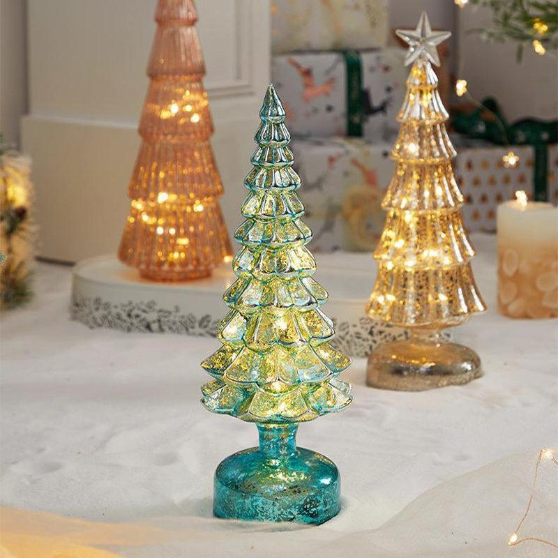 Christmas table decorations featuring colorful glass trees with lights, perfect for festive home decor.
