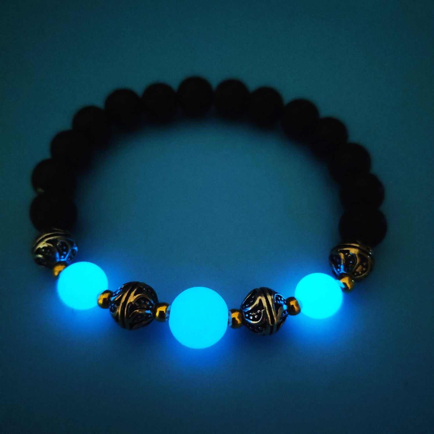 Luminous Beaded Bracelet for Women with glowing blue beads and antique metal accents