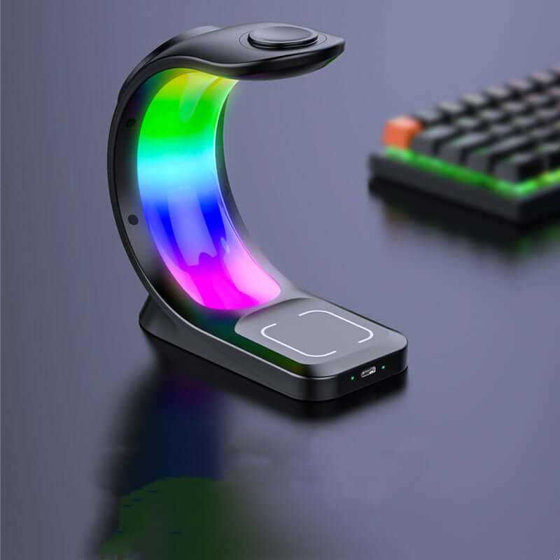 Magnetic wireless charger with RGB lighting effect beside a keyboard, showcasing its sleek design and modern features.